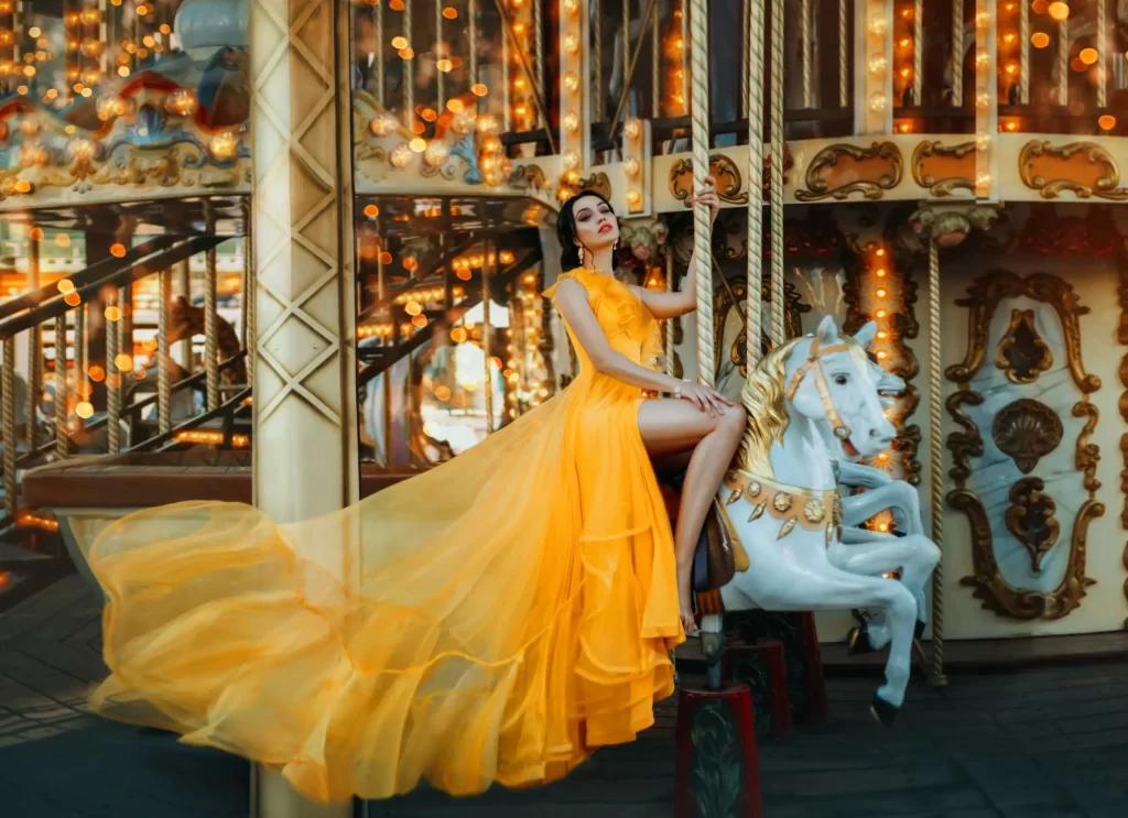 model in gown on carousel horse