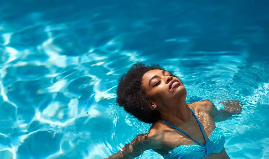 woman floating in pool relaxed 1775844656
