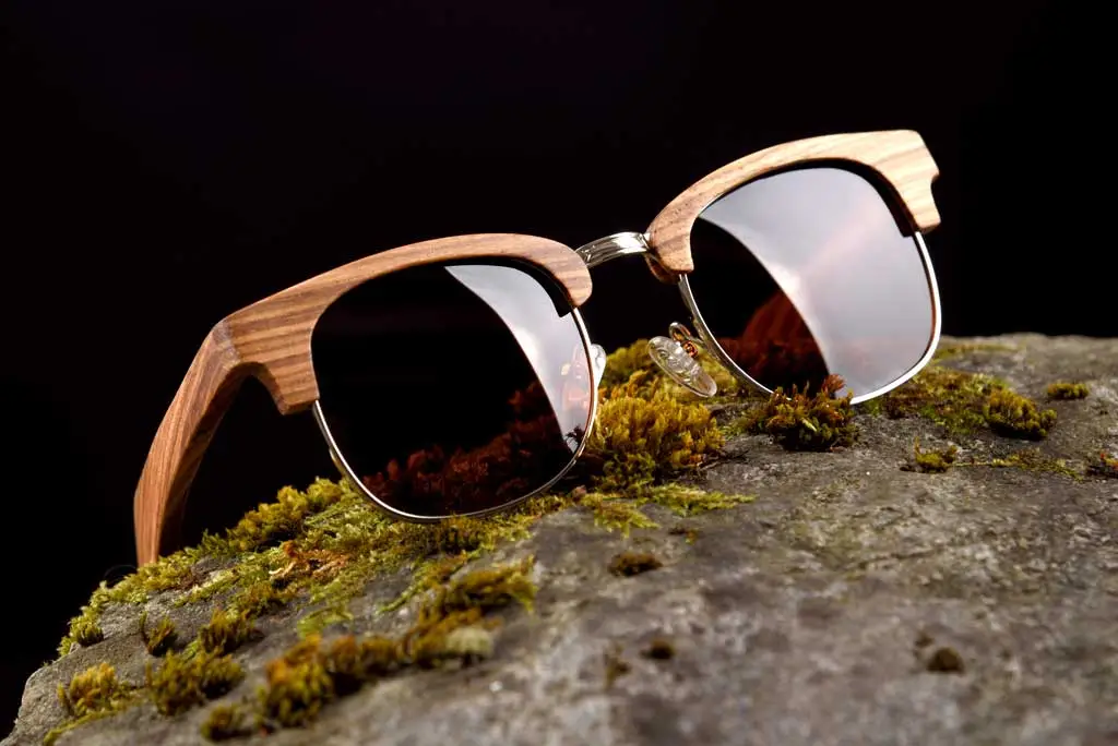 wood frame sunglasses on moss 1662106381