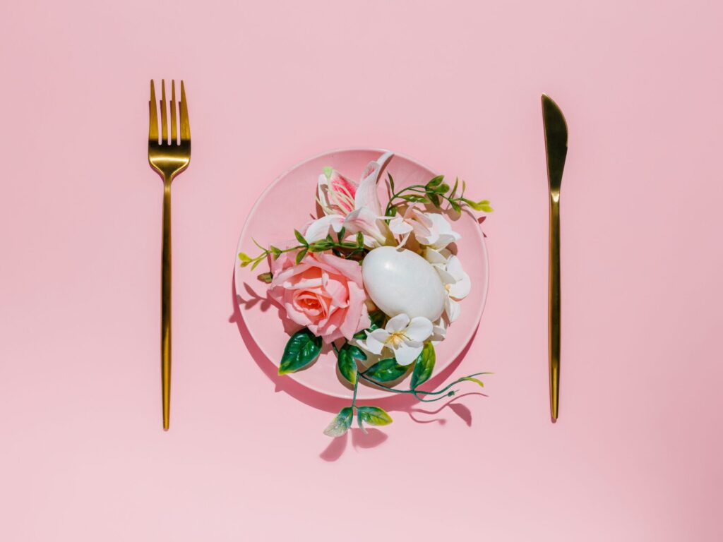 Table,Setting,With,Pink,Plate,Full,Of,Flowers,And,Egg